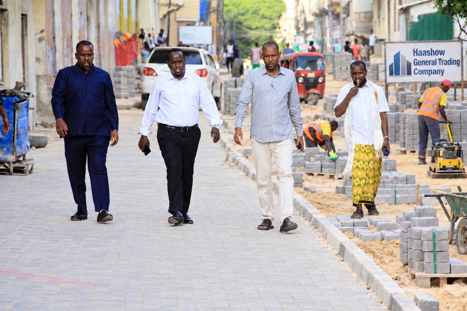 AI-edited reconstruction of a Bakaaraha road inspection using the supplied photograph